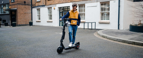 Our reviewer with Riley RS3 electric scooter