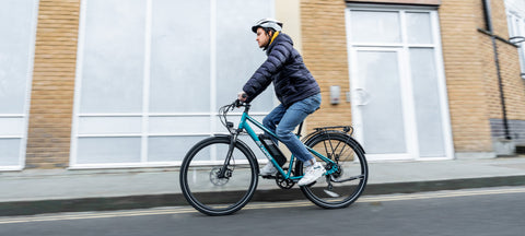 Our reviewer riding the Ampere Tourer S Hybrid electric bike